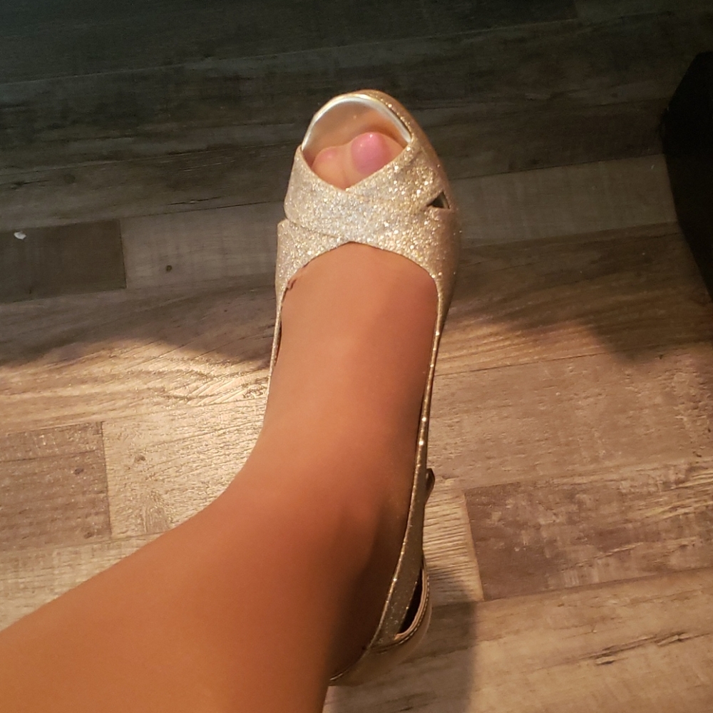 Gold shoe with light colored sock on per request